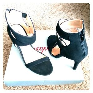 A pair of Black Suede Bonnibel Heels